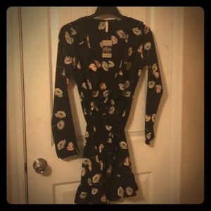 Black wrap dress with tan tinted floral print.